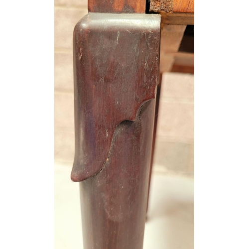 216 - A GOOD GEORGE III FOLD OVER MAHOGANY TEA TABLE with a break front design to the fold over top, venee... 