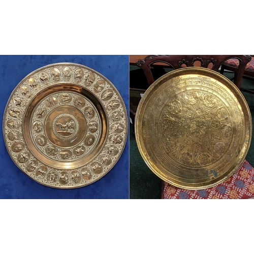 229 - TWO POLISHED BRASS DECORATIVE TRAYS, (i) One a brass zodiac charger/tray; decorated with figures in ... 