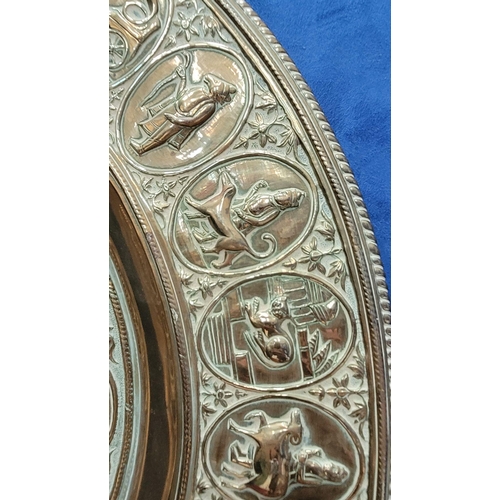 229 - TWO POLISHED BRASS DECORATIVE TRAYS, (i) One a brass zodiac charger/tray; decorated with figures in ... 