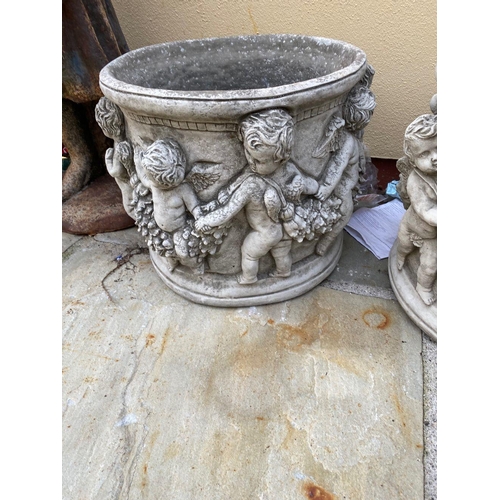 239 - A LOVELY PAIR OF CIRCULAR GARDEN PLANTER POTS, decorated all around with raised relief design in the... 