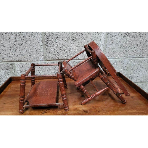 65 - AN ANTIQUE METAMORPHIC DOLLS HIGH CHAIR, with tray & foot rests, turned supports & arm rests. Folds ... 