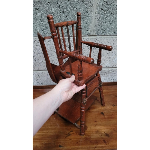65 - AN ANTIQUE METAMORPHIC DOLLS HIGH CHAIR, with tray & foot rests, turned supports & arm rests. Folds ... 