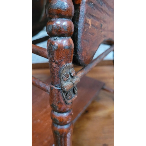 65 - AN ANTIQUE METAMORPHIC DOLLS HIGH CHAIR, with tray & foot rests, turned supports & arm rests. Folds ... 