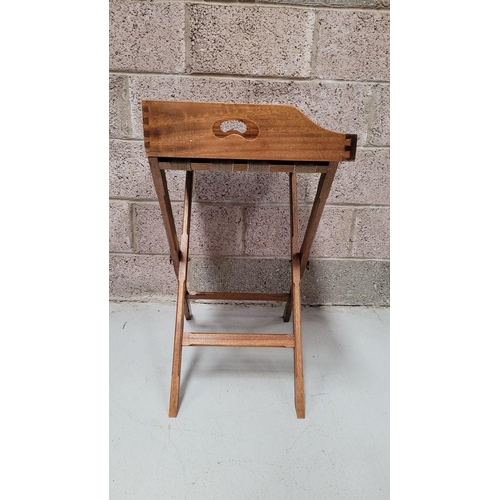 73 - A GOOD FOLDING BUTLER’S TRAY STAND, the tray with raised gallery sides has a pair of kidney shaped p... 