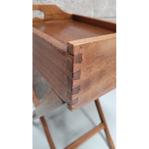 73 - A GOOD FOLDING BUTLER’S TRAY STAND, the tray with raised gallery sides has a pair of kidney shaped p... 