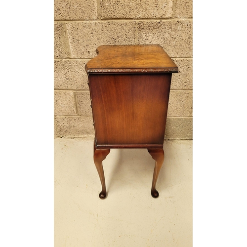 74 - A SERPENTINE SHAPED THREE DRAWER CHEST / CABINET / LOCKER, the edge decorated with carved gadrooned ... 