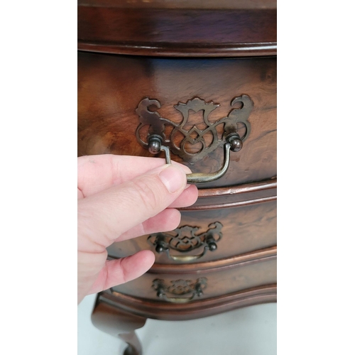74 - A SERPENTINE SHAPED THREE DRAWER CHEST / CABINET / LOCKER, the edge decorated with carved gadrooned ... 