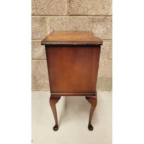 74 - A SERPENTINE SHAPED THREE DRAWER CHEST / CABINET / LOCKER, the edge decorated with carved gadrooned ... 