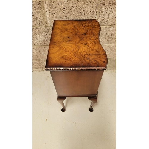 74 - A SERPENTINE SHAPED THREE DRAWER CHEST / CABINET / LOCKER, the edge decorated with carved gadrooned ... 