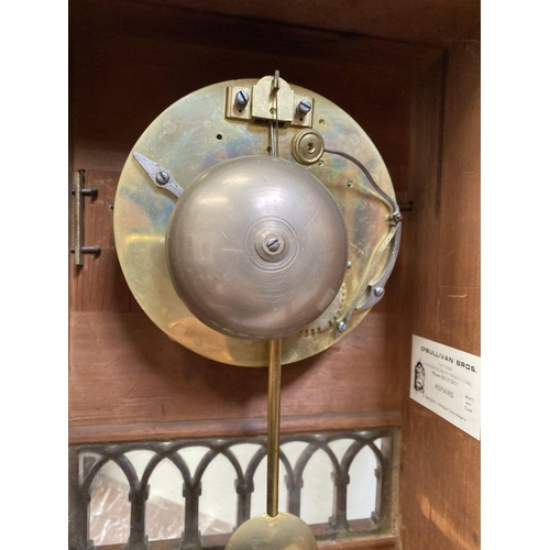 76 - A LATE 19TH CENTURY ASTRAGAL GLAZED MAHOGANY MANTEL CLOCK, with ormolu style mounts to the front, th... 