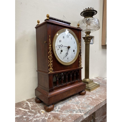76 - A LATE 19TH CENTURY ASTRAGAL GLAZED MAHOGANY MANTEL CLOCK, with ormolu style mounts to the front, th... 