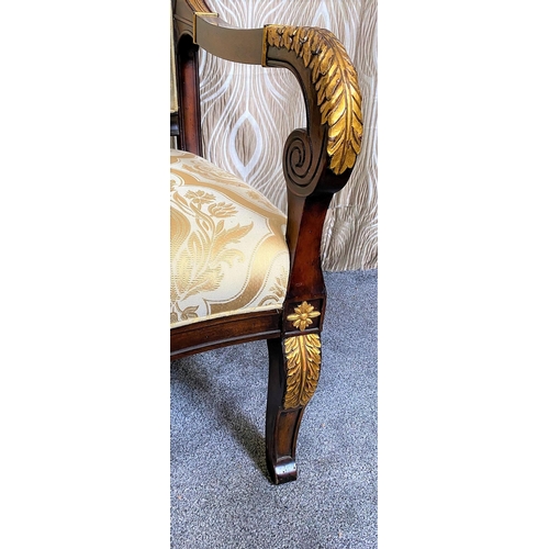 88 - A PAIR OF CARVED GILT DECORATED UPHOLSTERED ARMCHAIRS, each with scrolling foliage detail to the cre... 
