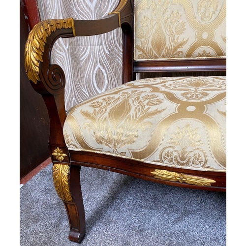 88 - A PAIR OF CARVED GILT DECORATED UPHOLSTERED ARMCHAIRS, each with scrolling foliage detail to the cre... 