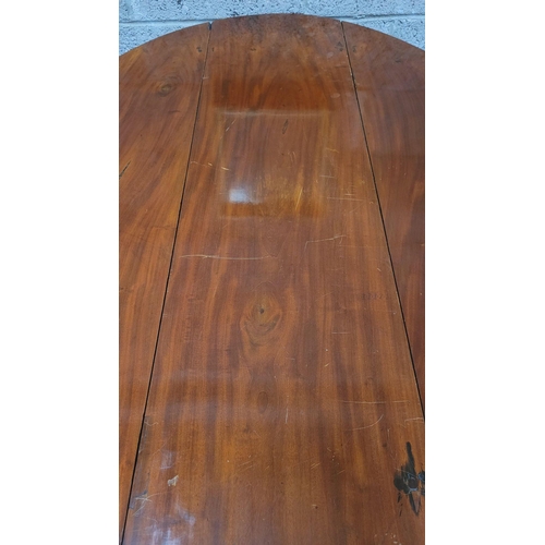 92 - AN IRISH GEORGIAN MAHOGANY DROP LEAF ‘HUNTS’ TABLE, the deep ‘D’ shaped leaves lift up and rest on a... 