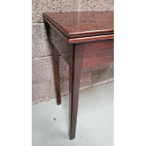 94 - A FINE 19TH CENTURY GEORGIAN STYLE FOLD OVER MAHOGANY TEA TABLE, raised on square leg, with fluted c... 