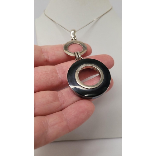 98 - A VINTAGE STERLING SILVER PENDANT & EARRING SET, pendant comprising of a loop & two circles that han... 