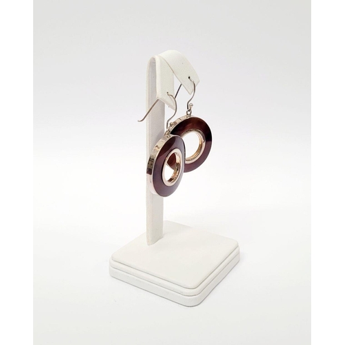 98 - A VINTAGE STERLING SILVER PENDANT & EARRING SET, pendant comprising of a loop & two circles that han... 