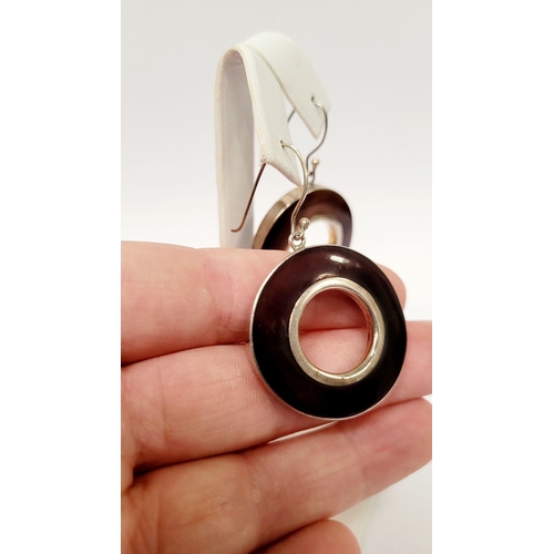 98 - A VINTAGE STERLING SILVER PENDANT & EARRING SET, pendant comprising of a loop & two circles that han... 