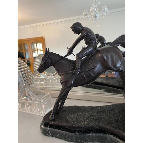 99 - A PAIR OF HEAVY BRONZED HORSE & JOCKEY ORNAMENTS, each of the ornamental figures rests on a marble b... 