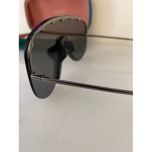 113 - A PAIR OF CASED GUCCI SUNGLASSES, comes with purchase receipts and papers, never used.