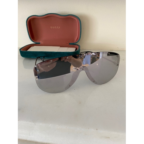 113 - A PAIR OF CASED GUCCI SUNGLASSES, comes with purchase receipts and papers, never used.