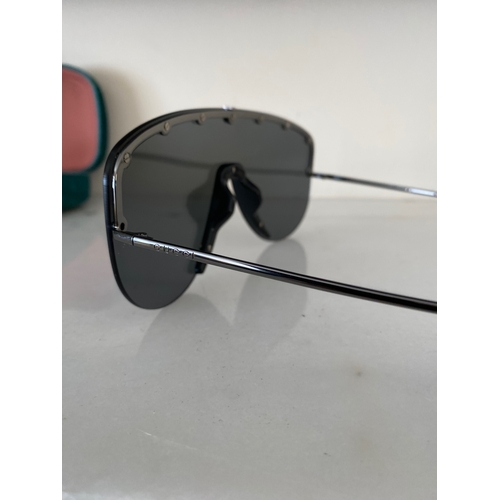 113 - A PAIR OF CASED GUCCI SUNGLASSES, comes with purchase receipts and papers, never used.