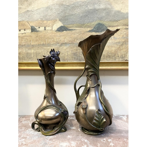 100 - TWO DECORATIVE VERONESE BRONZE PLATED VASES, the larger ewer vase with lotus leaf design to handle a... 