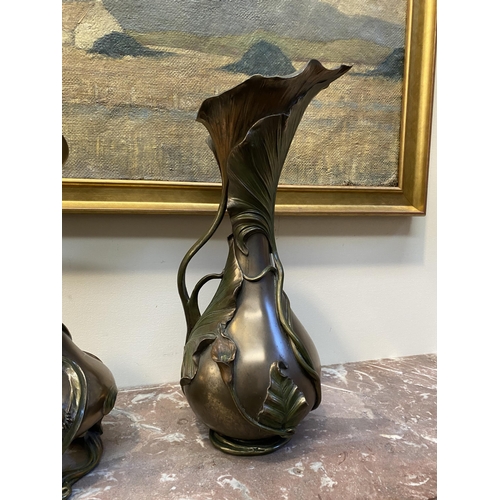 100 - TWO DECORATIVE VERONESE BRONZE PLATED VASES, the larger ewer vase with lotus leaf design to handle a... 