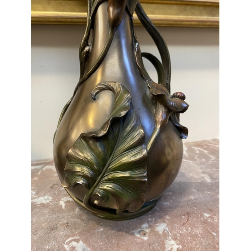 100 - TWO DECORATIVE VERONESE BRONZE PLATED VASES, the larger ewer vase with lotus leaf design to handle a... 