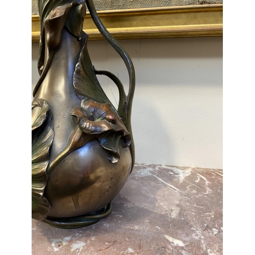 100 - TWO DECORATIVE VERONESE BRONZE PLATED VASES, the larger ewer vase with lotus leaf design to handle a... 