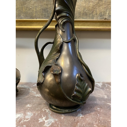 100 - TWO DECORATIVE VERONESE BRONZE PLATED VASES, the larger ewer vase with lotus leaf design to handle a... 