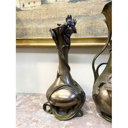 100 - TWO DECORATIVE VERONESE BRONZE PLATED VASES, the larger ewer vase with lotus leaf design to handle a... 