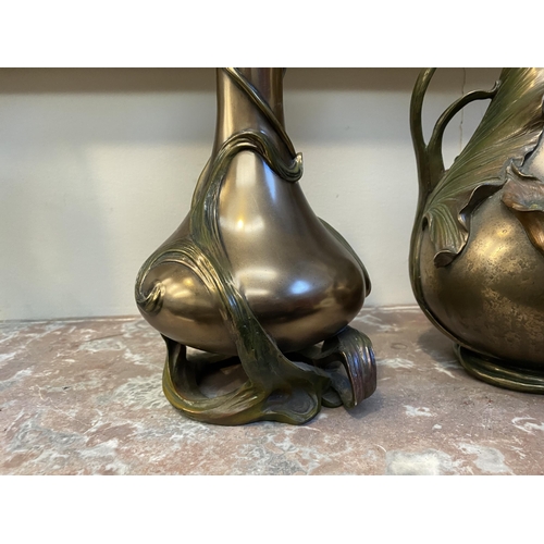 100 - TWO DECORATIVE VERONESE BRONZE PLATED VASES, the larger ewer vase with lotus leaf design to handle a... 