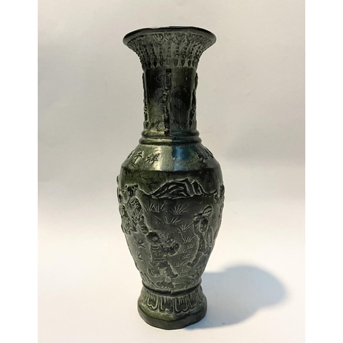 102 - A CHINESE BRONZE URN VASE, with textured fluted design to rim and base, figural design to body in re... 