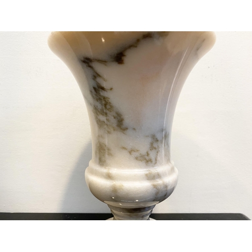 104 - A BEAUTIFUL WHITE MARBLE URN VASE, simple elegant form on circular platform base. Dimensions: 21cm h... 