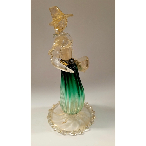 105 - A VINTAGE MURANO STYLE GLASS ORNAMENTAL FIGURINE, depicting a figure holding a basket. The skirt in ... 