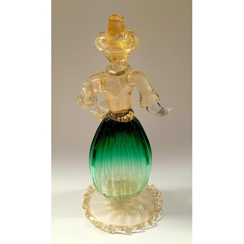 105 - A VINTAGE MURANO STYLE GLASS ORNAMENTAL FIGURINE, depicting a figure holding a basket. The skirt in ... 