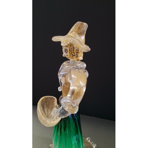 105 - A VINTAGE MURANO STYLE GLASS ORNAMENTAL FIGURINE, depicting a figure holding a basket. The skirt in ... 