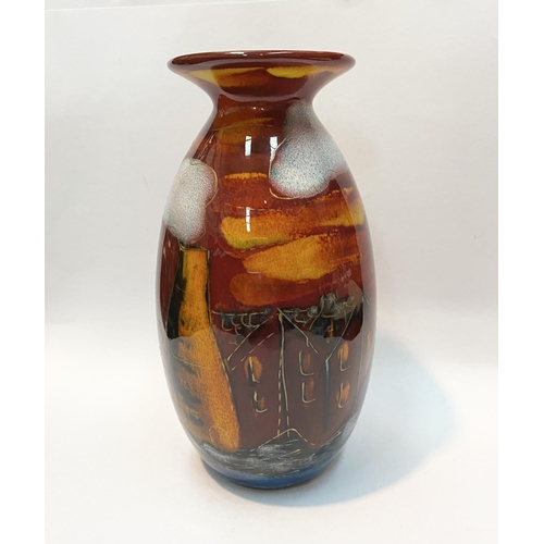 106 - A VIBRANT ANITA HARRIS POTTERIES PAST VASE, with decorative multi-coloured glaze depicting houses et... 