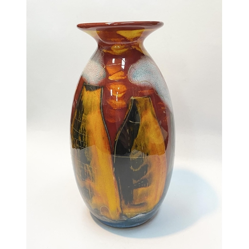 106 - A VIBRANT ANITA HARRIS POTTERIES PAST VASE, with decorative multi-coloured glaze depicting houses et... 