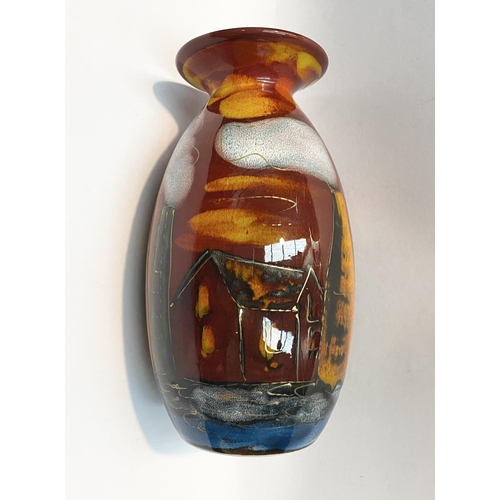 106 - A VIBRANT ANITA HARRIS POTTERIES PAST VASE, with decorative multi-coloured glaze depicting houses et... 