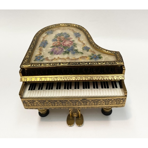 11 - A CHARMING AUSTRIAN GILT ORMOLU PIANO MUSIC BOX, by Reuge, this miniature piano is decorated with a ... 