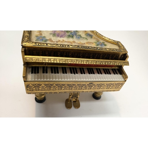 11 - A CHARMING AUSTRIAN GILT ORMOLU PIANO MUSIC BOX, by Reuge, this miniature piano is decorated with a ... 