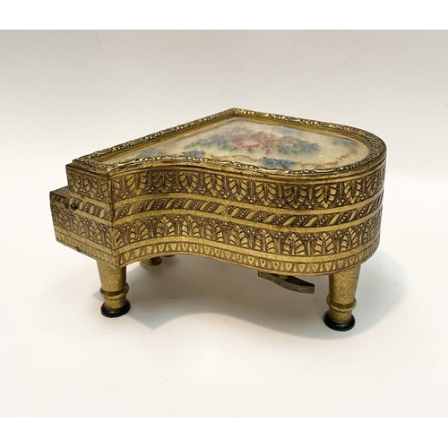 11 - A CHARMING AUSTRIAN GILT ORMOLU PIANO MUSIC BOX, by Reuge, this miniature piano is decorated with a ... 