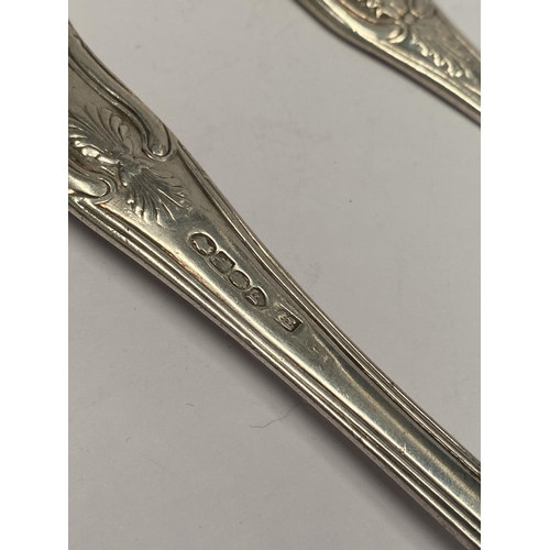 111 - TWO GEORGE IV IRISH SILVER TABLESPOONS, In the Kings pattern. Makers marks rubbed, Hallmarked London... 