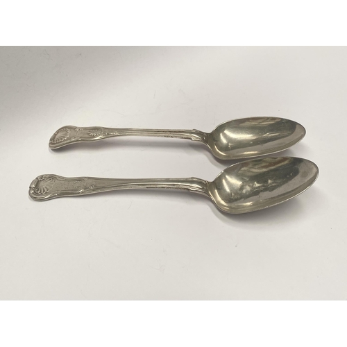 111 - TWO GEORGE IV IRISH SILVER TABLESPOONS, In the Kings pattern. Makers marks rubbed, Hallmarked London... 