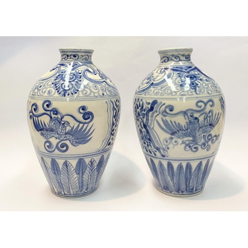 118 - A PAIR OF PAINTED PORCELAIN BLUE AND WHITE VASES, inverted bulbous form with narrow neck, decorated ... 