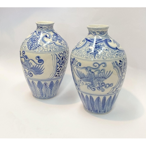 118 - A PAIR OF PAINTED PORCELAIN BLUE AND WHITE VASES, inverted bulbous form with narrow neck, decorated ... 