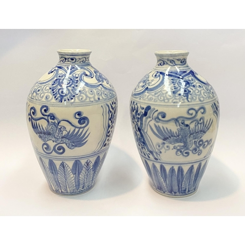 118 - A PAIR OF PAINTED PORCELAIN BLUE AND WHITE VASES, inverted bulbous form with narrow neck, decorated ... 