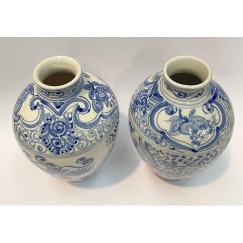 118 - A PAIR OF PAINTED PORCELAIN BLUE AND WHITE VASES, inverted bulbous form with narrow neck, decorated ... 